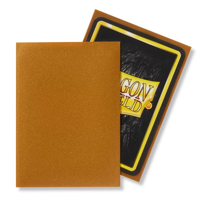 Accessoires Transparante voorkant en matte gouden achterkant. Een box bevat 100 sleeves. Ontworpen voor gebruik met Magic: The Gathering ™, Pokémon ™ en andere kaartspellen.